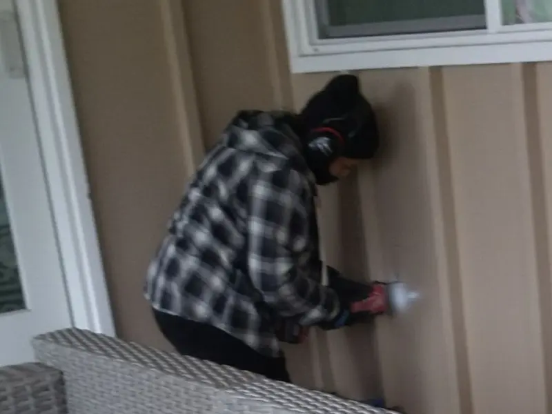 Professional electrician installing an exterior outlet in Maeser