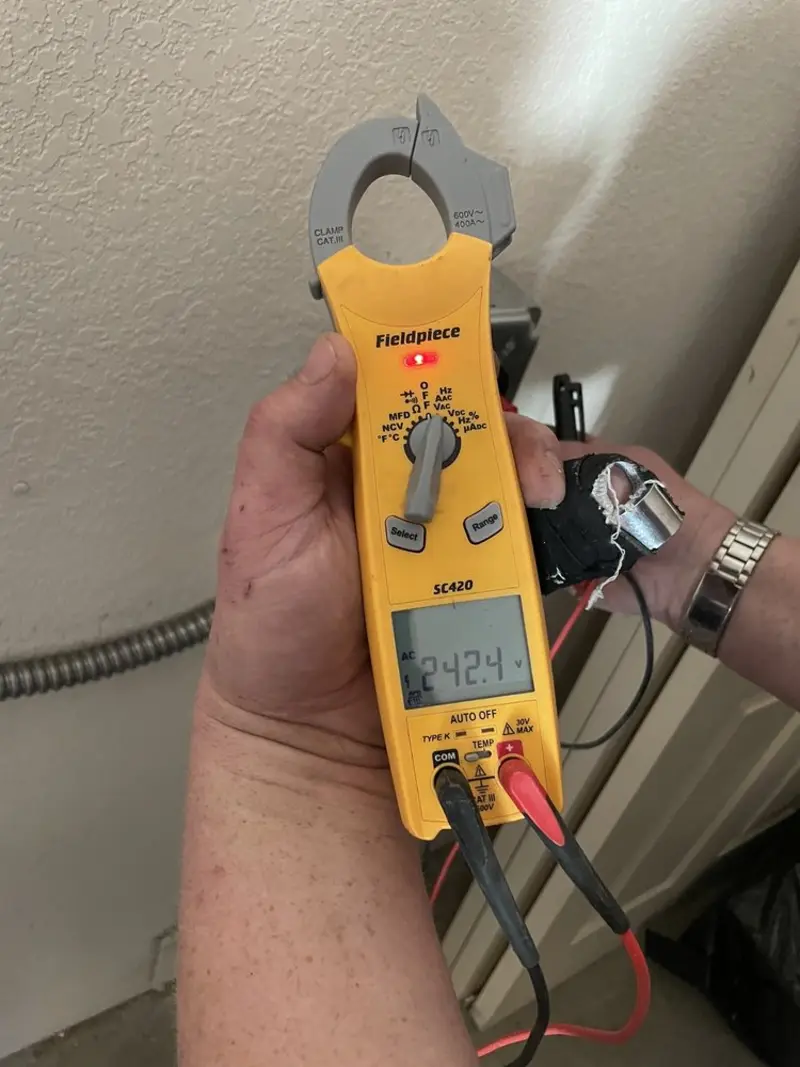 Voltage testing with clamp meter during Generator Installation in Maeser